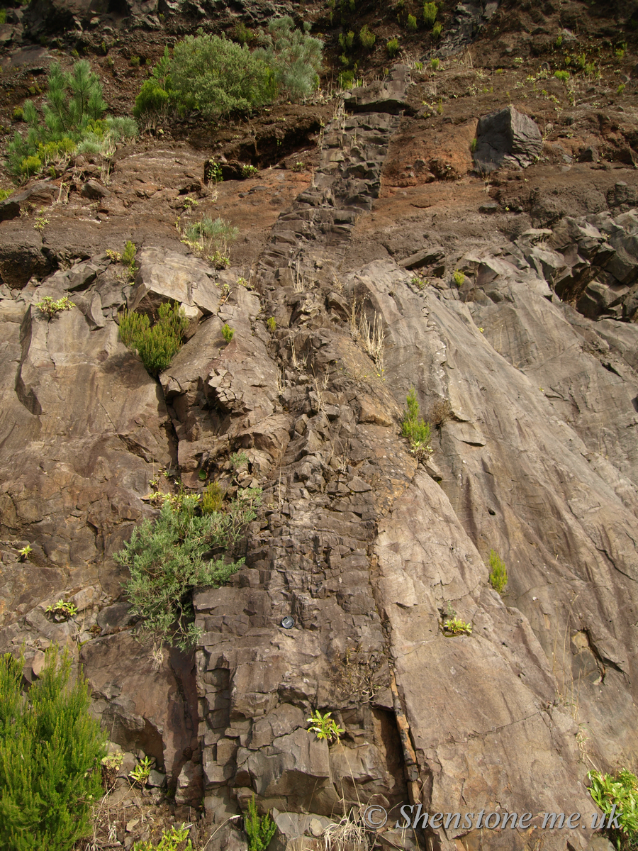 Dyke cutting through basalt and ash layers Encumeada & Paul da Serra